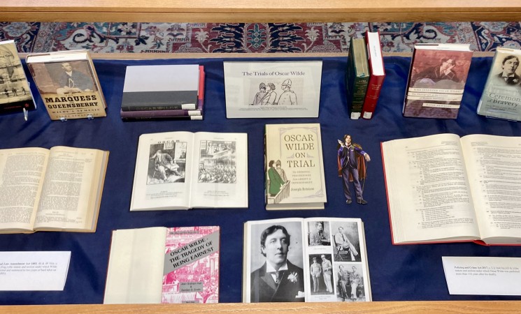 Book display on Oscar Wilde with closed and open books and pictures of Oscar Wilde.