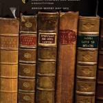 Cover image of the 2012-2013 annual report with a close-up image of old law book spines