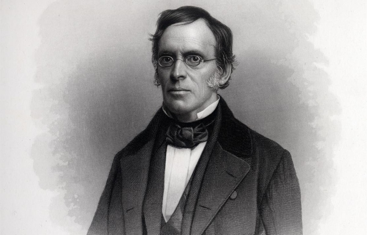 Black and white engraving of a 19th century man with glasses