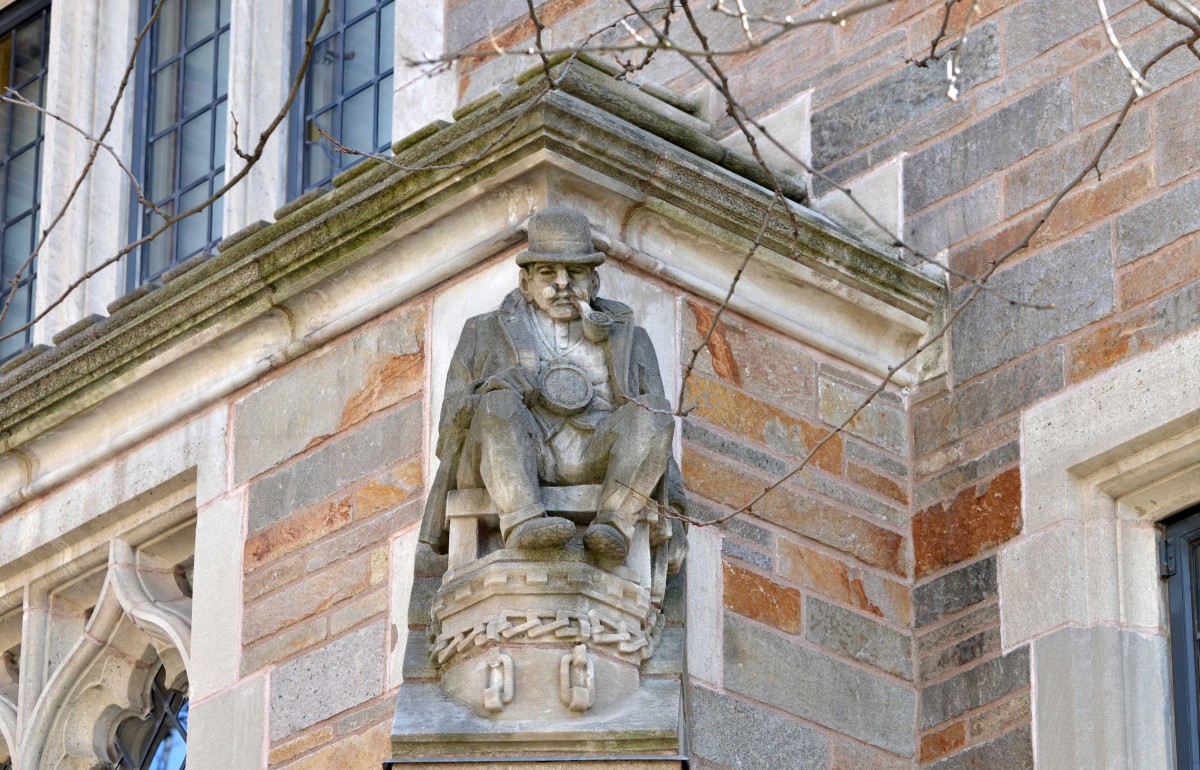 Photograph of a detective gargoyle that adorns the outside of the law school.