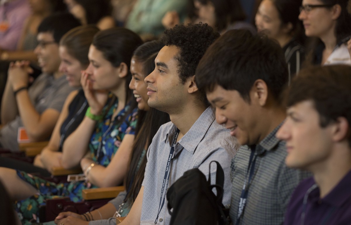 Close up of a row of students sitting down.