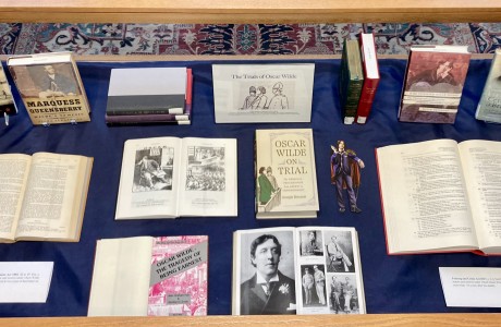 Book display on Oscar Wilde with closed and open books and pictures of Oscar Wilde.