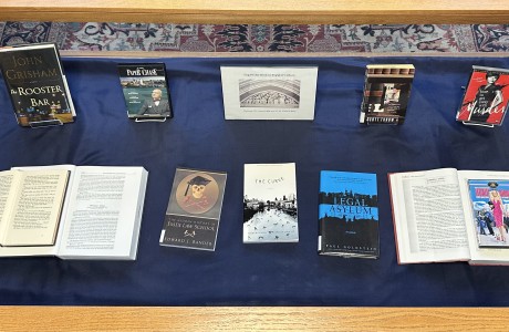 Bird's eye photograph of an exhibit display case with books and DVDs